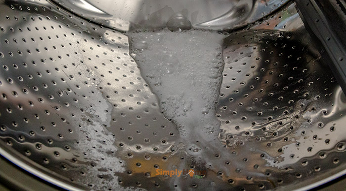 Pour Baking Soda and white vinegar into the Drum’s Front-Load Washer